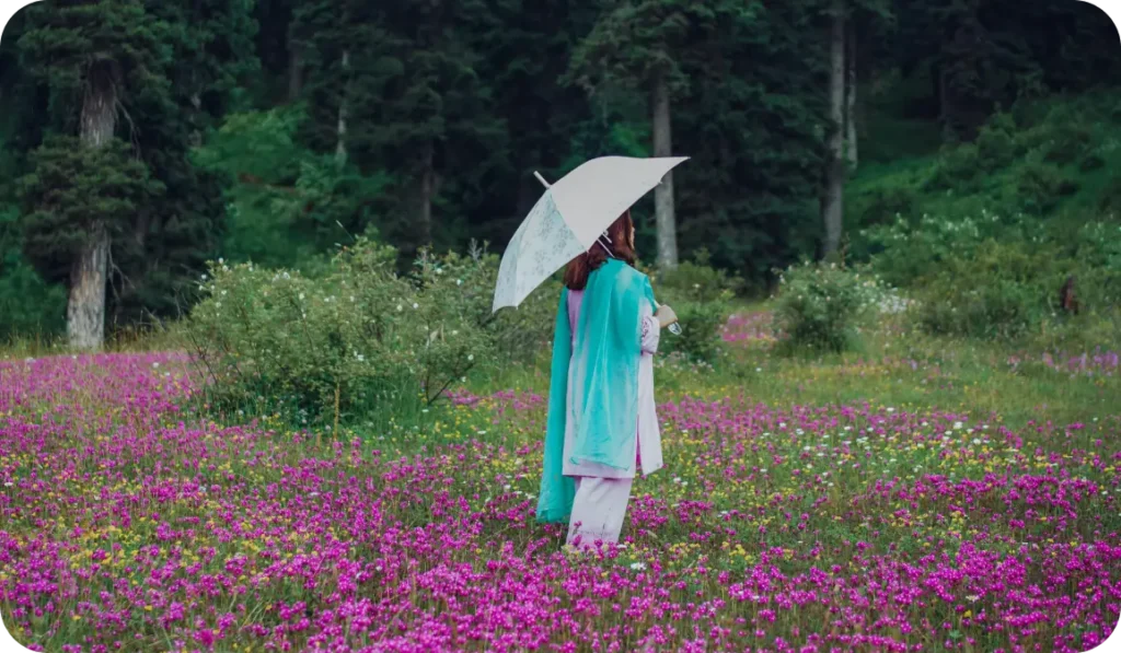 Girl standing in blossoms in yusmarg